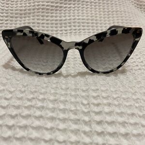 Gray and black Prada sunglasses